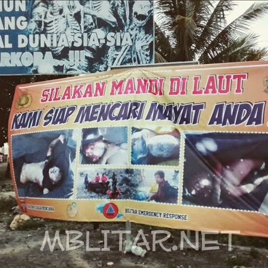 peringatan mandi di laut